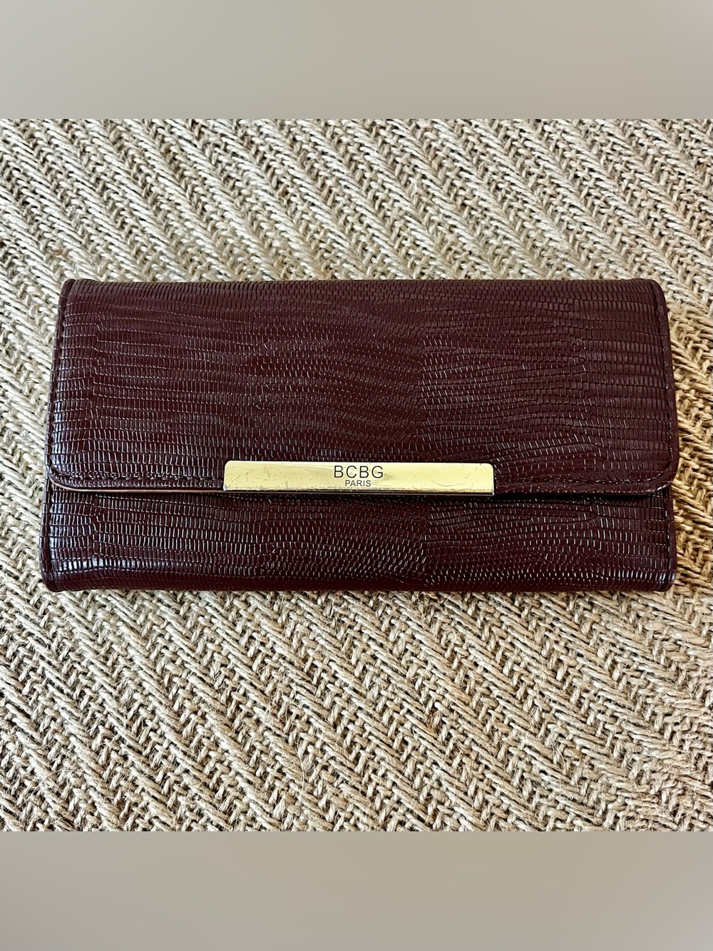 BCBG Paris Burgundy Textured Envelope Clutch with Gold Logo